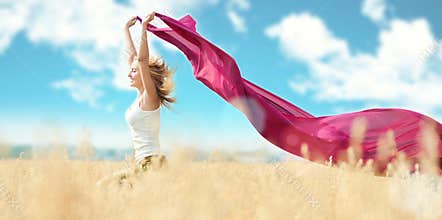 Happy woman on picnic in wheat field