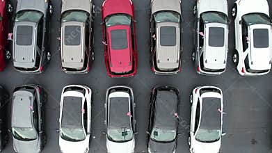 Rows of Brand New Car in an American Dealerships Stock Aerial View.