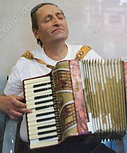 Middle age man plays music with passion