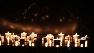 Background of candles flickering and flashing on a black background