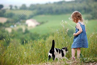Adorable little girl and a cat