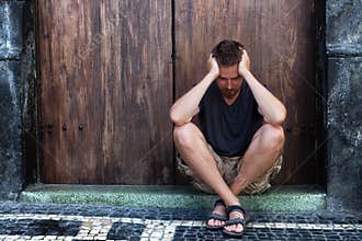 Depression - sad and poor man on the street