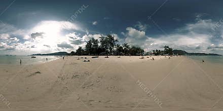 360 VR beautiful beach sea sand and sky. The big sun in the clouds touches the horizon. Asian palm beach background