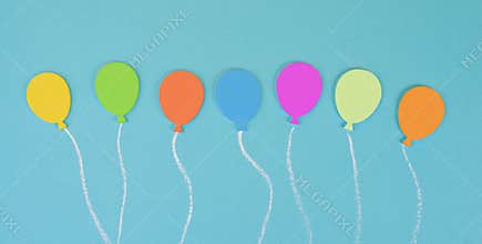 Colorful ballons on a blue colored background, children birthday greeting card, happy holiday, copy space
