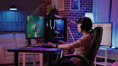 Gamer girl feeling disappointed after losing difficult level in online space shooter on gaming pc