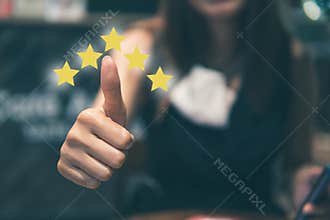 Customer review good rating concept hand pressing five star on visual screen and positive customer feedback testimonial