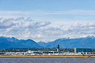 RICHMOND, CANADA - APRIL 01, 2020: view to the Frazer river and YVR international vancouver airport with cloudy sky