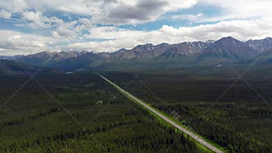 Lonley Alaska Highway Heads towards the Mountains