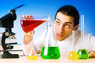 Chemist in the lab experimenting