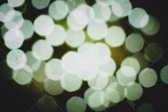 Defocused, Abstract Backgrounds. Illuminated Night Shiny Circle Spotted Pattern. Glowing Photographic Effects. Bright Christmas