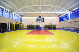 Inside school gym hall with red-yellow floor