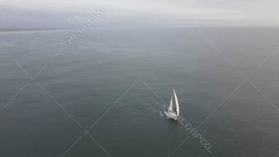 Sloop sailing in calm water