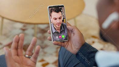 Businessman in video conference with smartphone