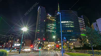 Milan skyline with modern skyscrapers in Porta Nuova business district night timelapse in Milan, Italy