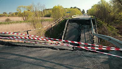 Falling parts and fittings, danger. Damaged roads on an old bridge. Broken road