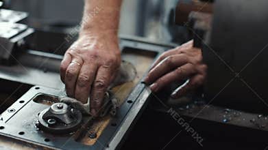 Service and repair of machine tools in a machine shop or workshop.