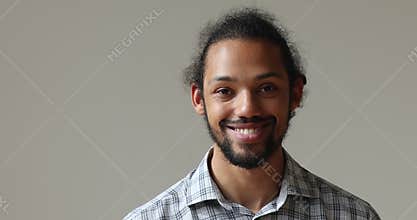 Happy young authentic african american hipster man looking at camera.