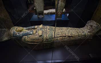 Ancient Egyptian statues and mummy on display of the Museums of Vatican in Vatican City, Rome, Italy
