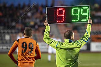 Referee shows players substitution
