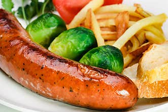 German sausage with potatoes and vegetables.
