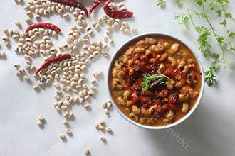 A gravy with white cowpea beans also known as black eyed pea. Boiled cowpea beans simmered in a rich gravy of onions, tomatoes,