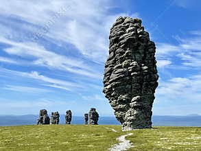 Stone pillars of weathering on the Manpupuner mountain plateau in the Komi Republic in Russia in summer in clear weather