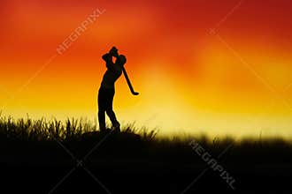 Miniature people toy figure photography. Silhouette of men golfer swing his stick at meadow field hill when sunset sunrise