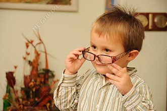 Young boy with funny glasses