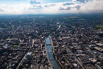 Aerial view of skyline of Dublin with river flowing with bridge connecting two sides of street surrounded by buildings
