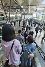 Travelers with masks boarding train, Wuxi, China
