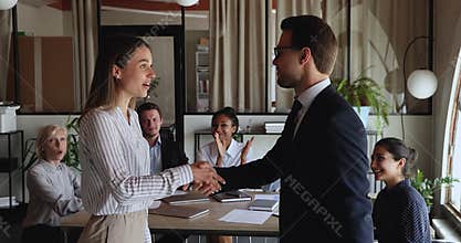 Company leader shake hands praising encouraging best employee of month