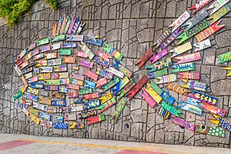 Wall art made of painted wooden fish in Busan Culture Village in Busan, Korea