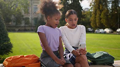 Little kids girls female children friends multiracial ethnic sisters African American Indian schoolgirls pupils