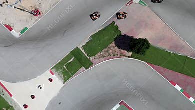 Drone shooting, people ride cars in karting