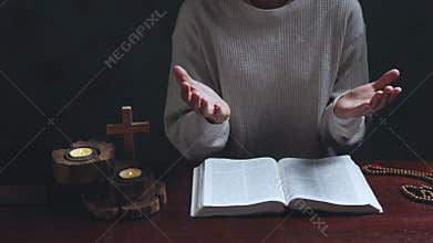 Woman hands praying to god with the bible. Begging for forgiveness and believe in goodness. Christian life crisis prayer to god.