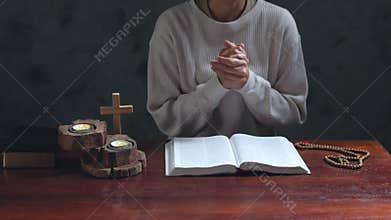 Woman hands praying to god with the bible. Begging for forgiveness and believe in goodness. Christian life crisis prayer to god.