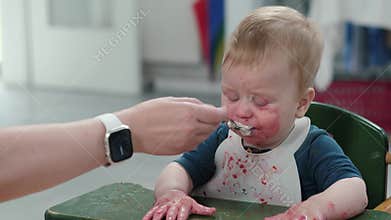Messy Baby Enjoying Food