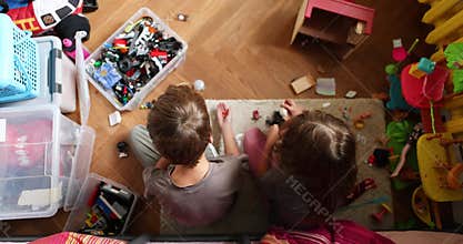 Children engaging in playtime with toys on a cozy rug