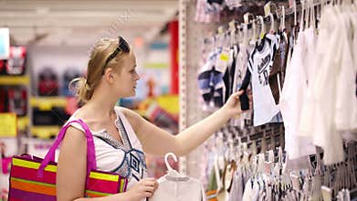 Mother shopping for childrens clothes