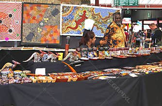 Aboriginal man sells Aboriginal art at the Queen Victoria Market,Melbourne,Australia