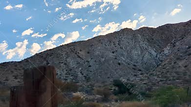 Clouds moving over desert mountain time lapse
