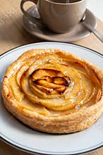 French fresh baked sweet puff pastry with fresh apple fruits in sirup in confectionery shop