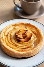 French fresh baked sweet puff pastry with fresh apple fruits in sirup in confectionery shop