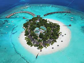 A beautiful island with a luxury resort surrounded by isolated turquoise waters