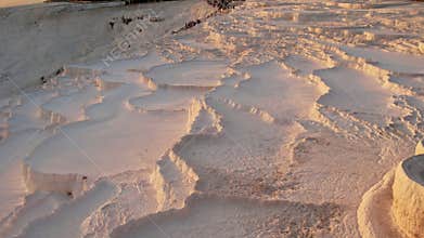 Aerial view of the travertines in Pamukkale in a beautiful sunset, Turkey. White limestone mineral formations. Turkish