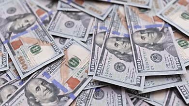 Piles of 100 dollar bill wads