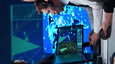 Workplace of the air traffic controllers in the control tower. Team of professional aircraft control officers works