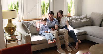 Family spending leisure using modern smart phone