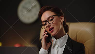 Young successful realtor talking into smartphone about new property buying. Yes, we can help with your contract issues