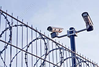 Security cameras over fence